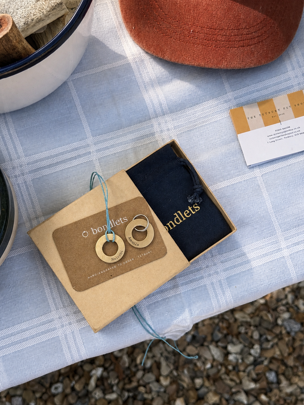Bondlets engraved dog tag and matching owner pendant in brass, hand-engraved at The Tetbury Pet Shop