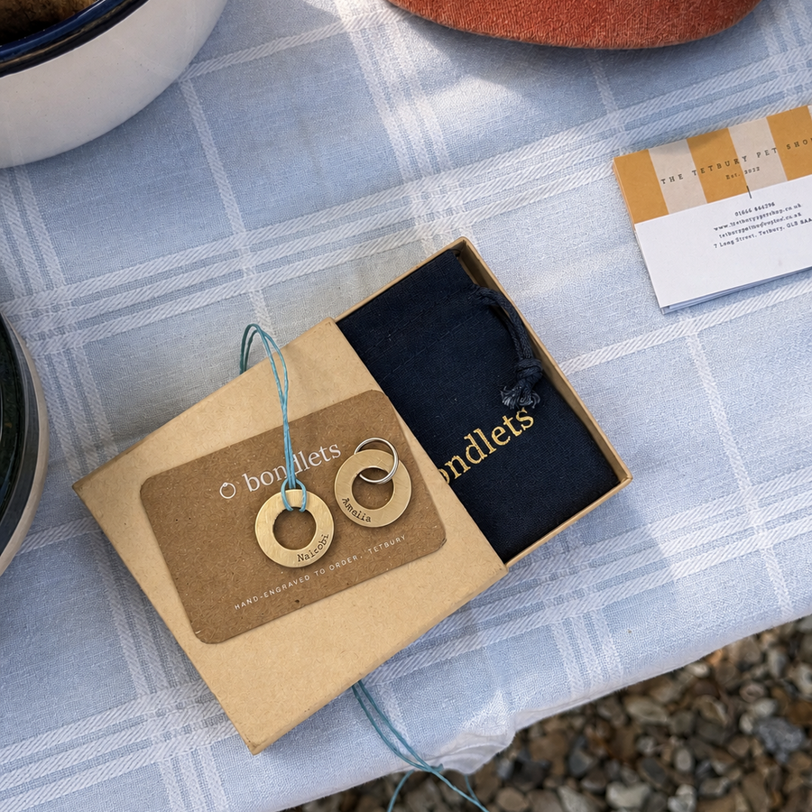 Bondlets engraved dog tag and matching owner pendant in brass, hand-engraved at The Tetbury Pet Shop