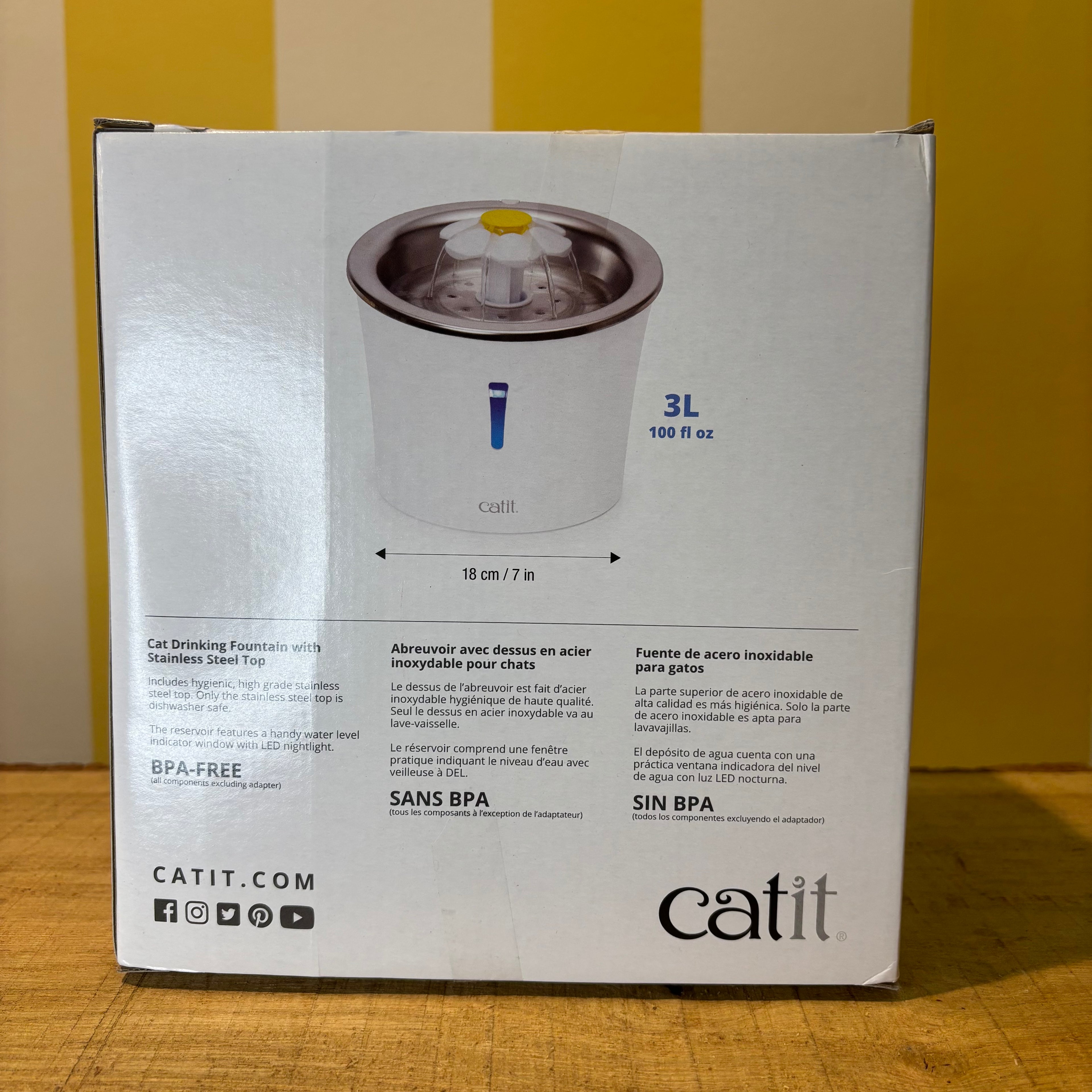 A box of The Tetbury Pet Shop & Grooming Catit Stainless Steel water fountain for cats, featuring a photo of a cat drinking from the 3-liter capacity fountain.