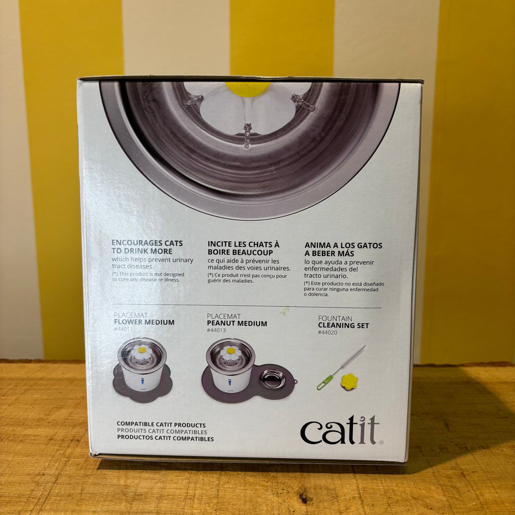 A box of The Tetbury Pet Shop & Grooming Catit Stainless Steel water fountain for cats, featuring a photo of a cat drinking from the 3-liter capacity fountain.
