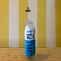 The Tetbury Pet Shop & Grooming's Chill Pill is a plush blue and white capsule toy for dogs, labeled "CHILL PILL" and hanging from a clip—perfect as a quirky squeaky toy for your pup.