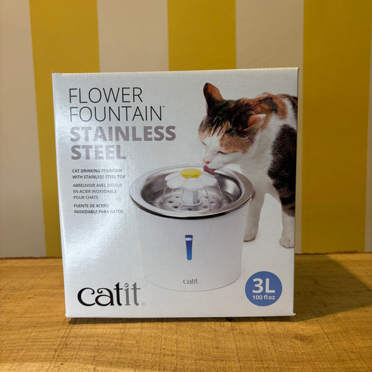 A box of The Tetbury Pet Shop & Grooming Catit Stainless Steel water fountain for cats, featuring a photo of a cat drinking from the 3-liter capacity fountain.