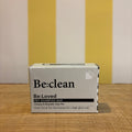 Three boxes of The Tetbury Pet Shop & Grooming's Be: Natural Shampoo Bars are stacked on wood with a yellow and white striped background, showcasing these eco-friendly pet shampoos.